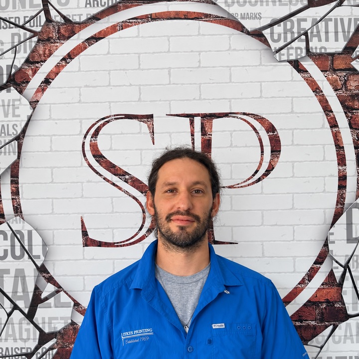 Anddy, Button Presser & Machine Whisperer at Sykes Printing